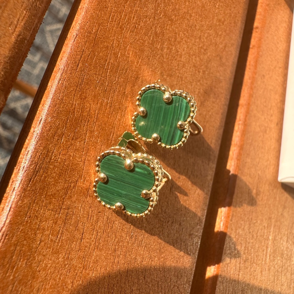 Van Cleef and Arpels look like Onyx jewelry. Real gold.